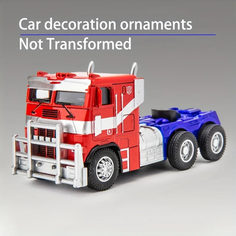 Camion rouge et bleu miniature style Optimus Prime en métal, fond gris, décoration voiture – Transformers.