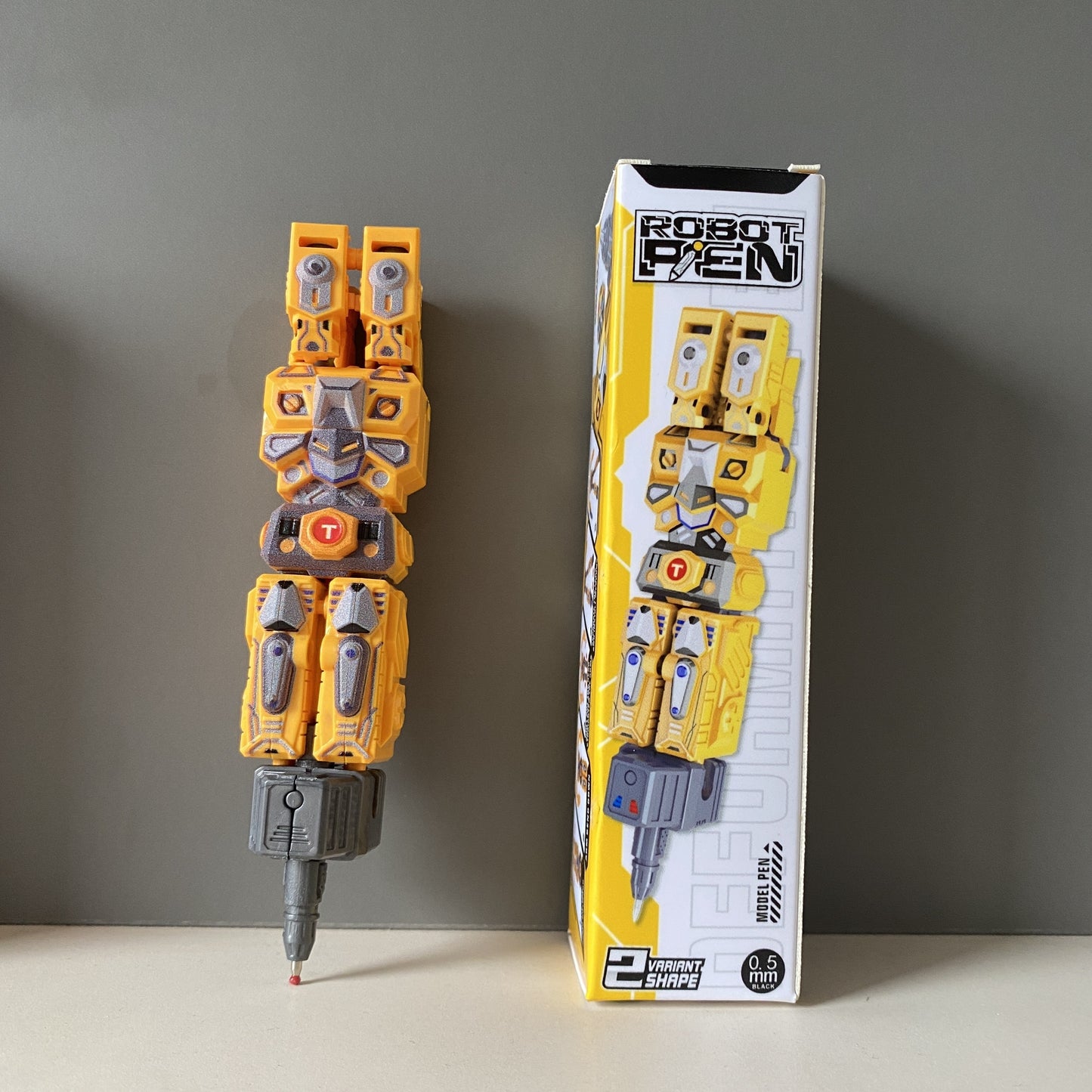 Figura y bolígrafo de Transformers 2 en 1, edición naranja