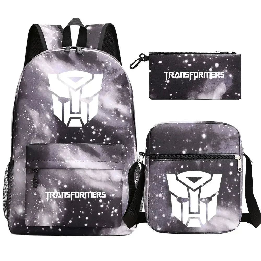 Ensemble sac à dos, sac bandoulière et trousse noir motif galaxie logo Autobots blanc – Transformers.
