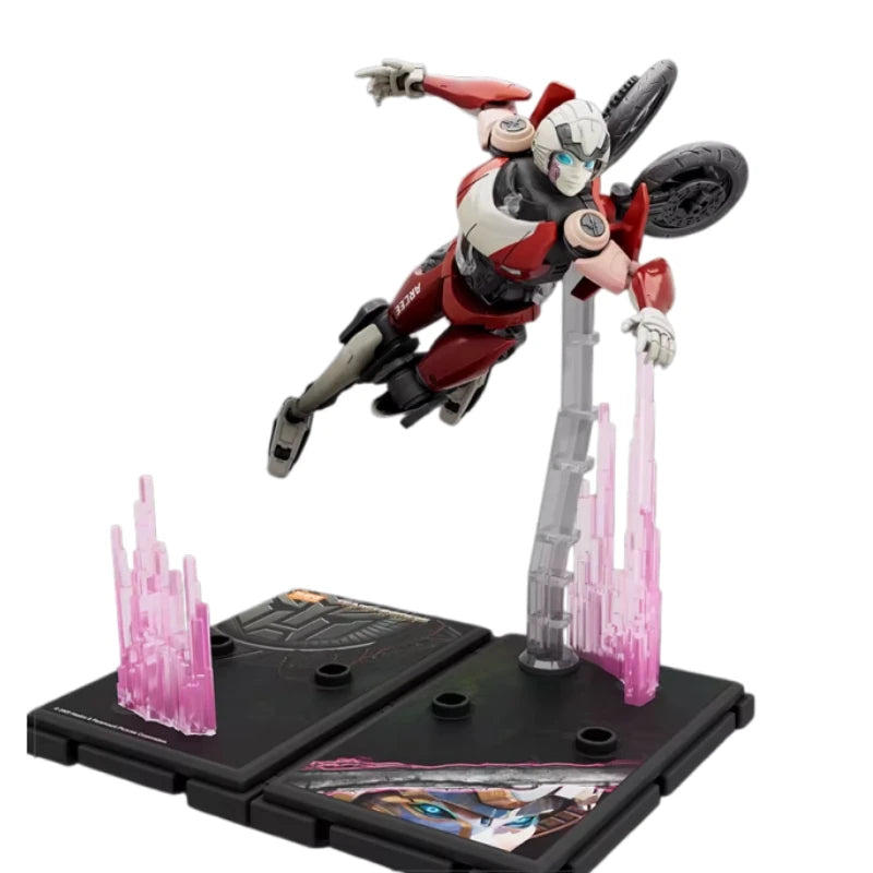 Figurine Transformers Arcee Vol Acrobatique — Robot Rose et Gris Socle Lumineux