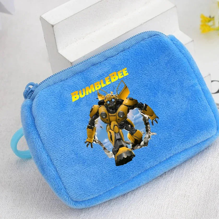 Pochette bleue en tissu avec Bumblebee jaune, décor ciel et logo, style enfant – Transformers.