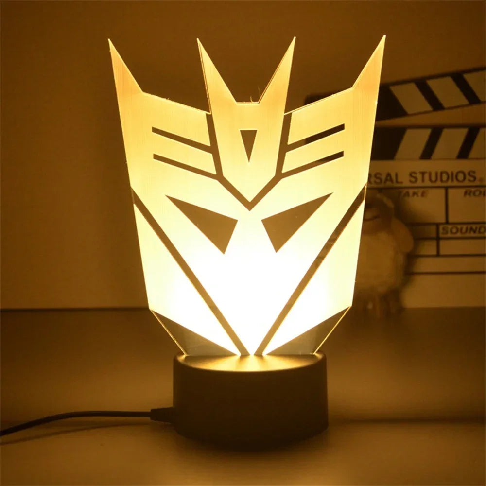 Lampe de table LED forme logo Decepticon, lumière jaune, décor geek moderne – Transformers.