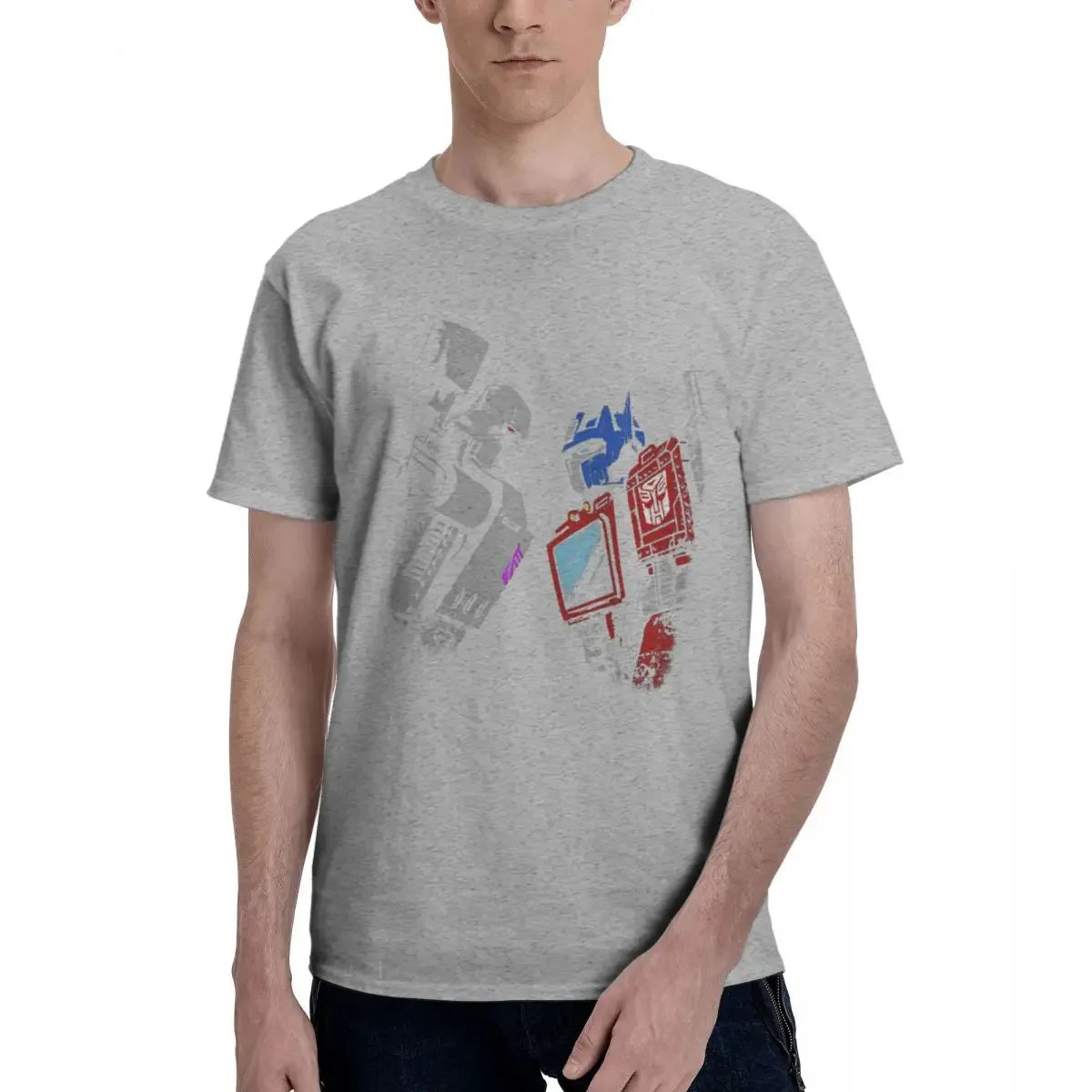 T-shirt gris avec robots stylisés colorés, personnage bleu et rouge sur fond uni – Transformers.