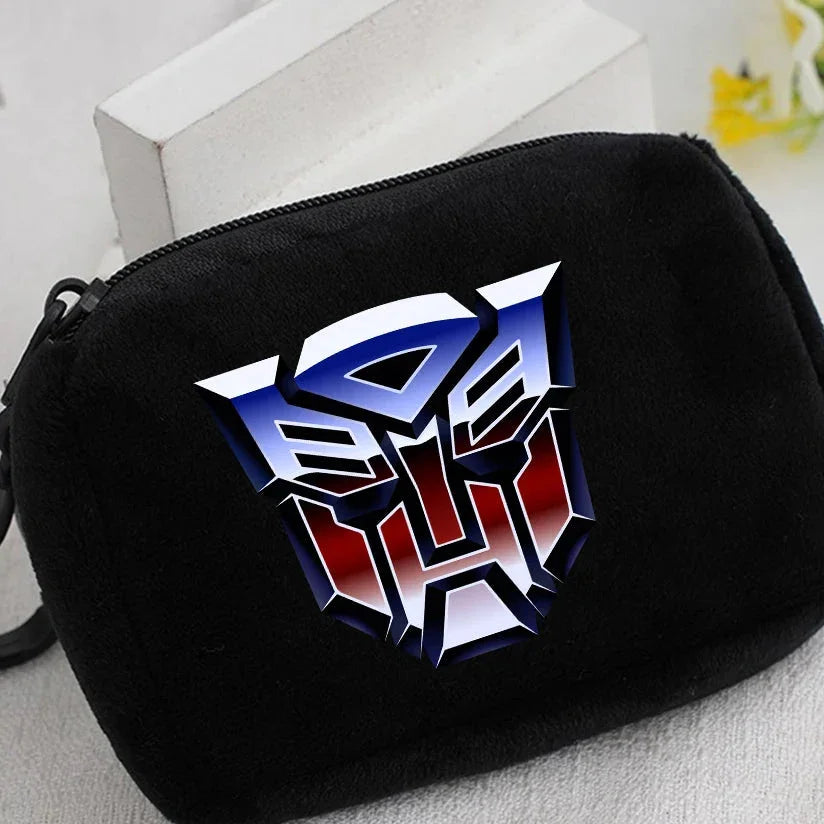 Petite trousse noire avec logo Autobot métallisé bleu, blanc et rouge sur fond uni – Transformers.