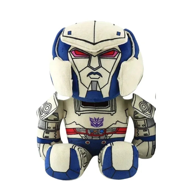 Peluche Megatron assis, robot gris et bleu, visage sérieux, détails rouges et violets – Transformers.
