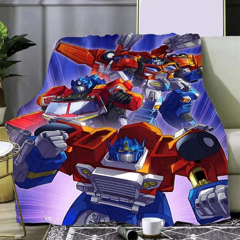 Plaid polaire avec robots Optimus Prime stylisés, fond bleu violet, décoration canapé – Transformers.