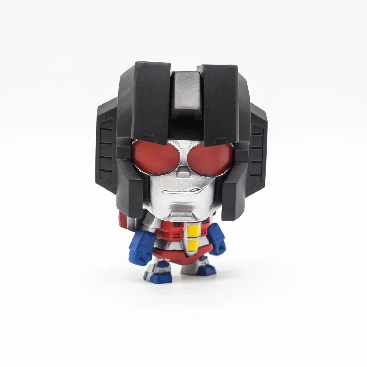 Figurine vinyl Starscream style chibi, casque noir, yeux rouges, décor blanc – Transformers.