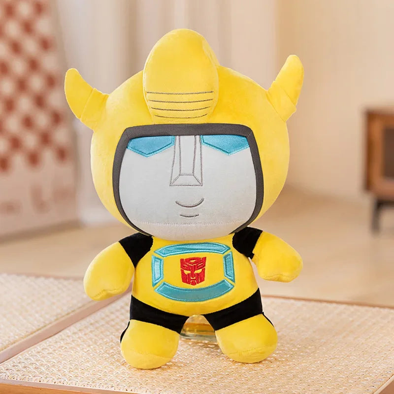 Peluche Bumblebee jaune avec logo Autobot, visage gris et décoration intérieure – Transformers.