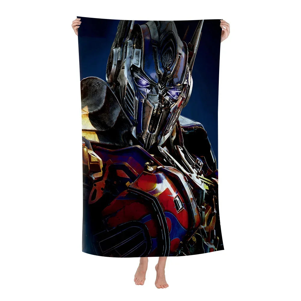 Drap de bain avec impression d’Optimus Prime en armure métallique sur fond bleu – Transformers.