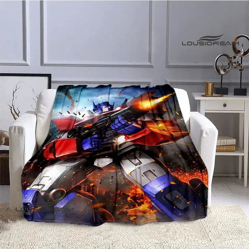 Plaid avec Optimus Prime en pleine action, fusil à la main, fond de flammes colorées – Transformers.