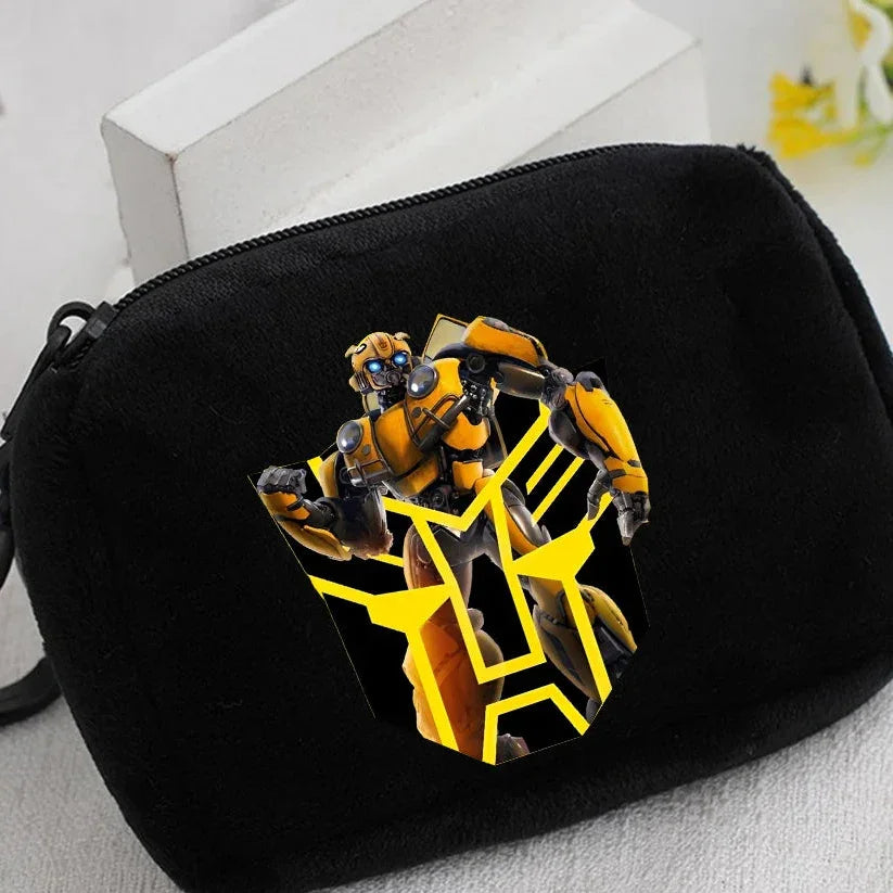 Pochette noire avec illustration de robot jaune Bumblebee et motif géométrique jaune – Transformers.