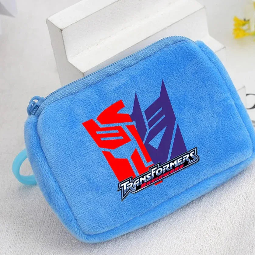 Trousse peluche bleue avec logo Transformers rouge et violet, fermeture éclair bleue – Transformers.