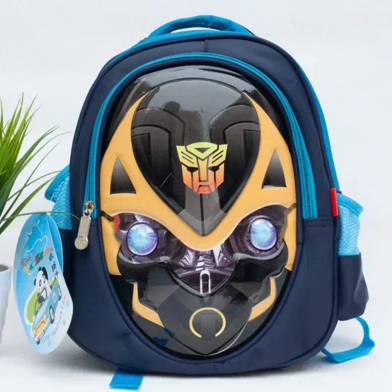 Sac à dos enfant bleu motif visage Bumblebee jaune et noir, yeux lumineux, logo Autobot – Transformers.