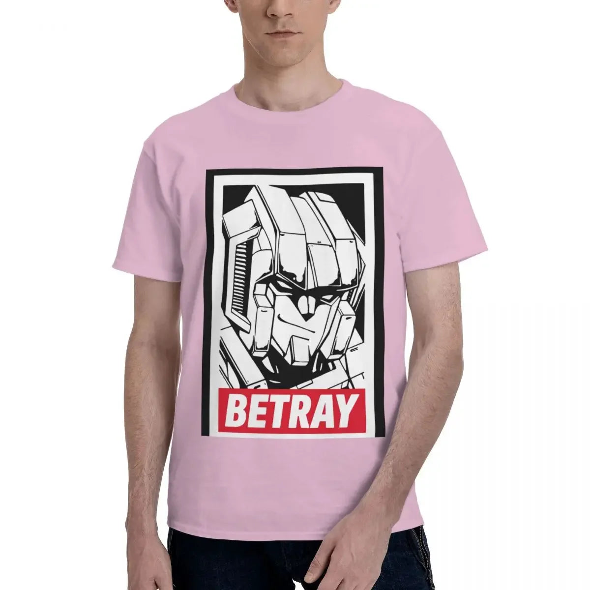 T-shirt rose avec dessin de robot Megatron, texte Betray en rouge, style graphique – Transformers.