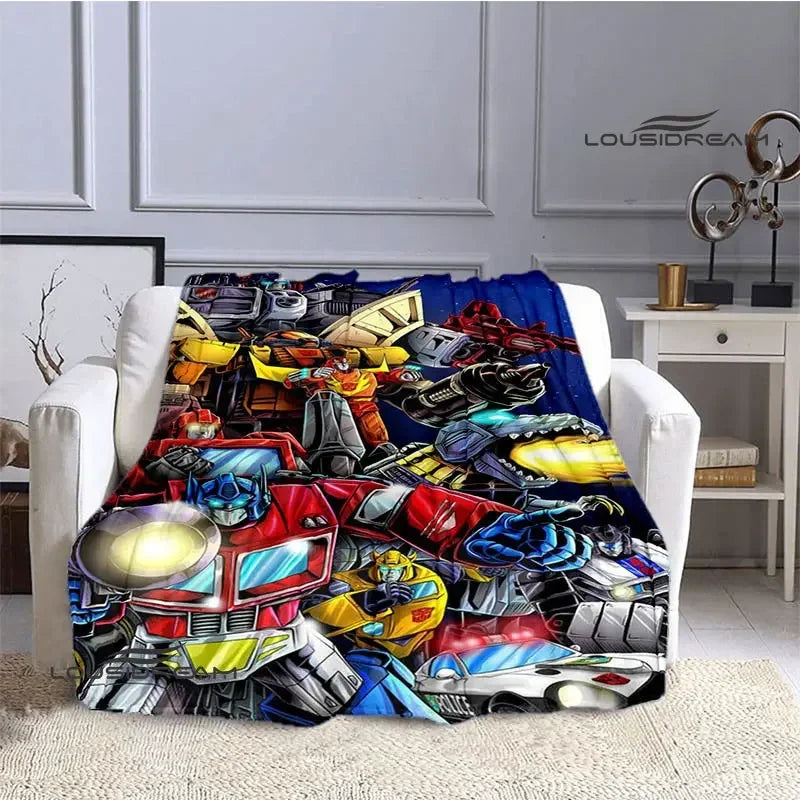 Plaid coloré Transformers avec Optimus Prime et Autobots sur un canapé, style bande dessinée – Transformers.