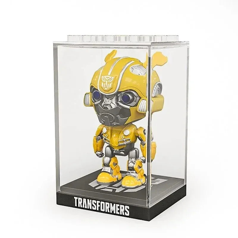 Figurine Bumblebee jaune stylisée dans une boîte vitrine transparente, fond blanc – Transformers.