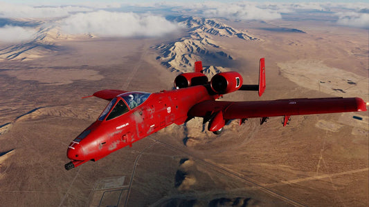 Avion de chasse rouge Transformers volant au-dessus du désert, cockpit fermé et montagnes à l’arrière-plan – Transformers.