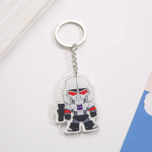 Porte-clés Transformers Megatron en acrylique, personnage robot gris stylisé sur fond blanc – Transformers.